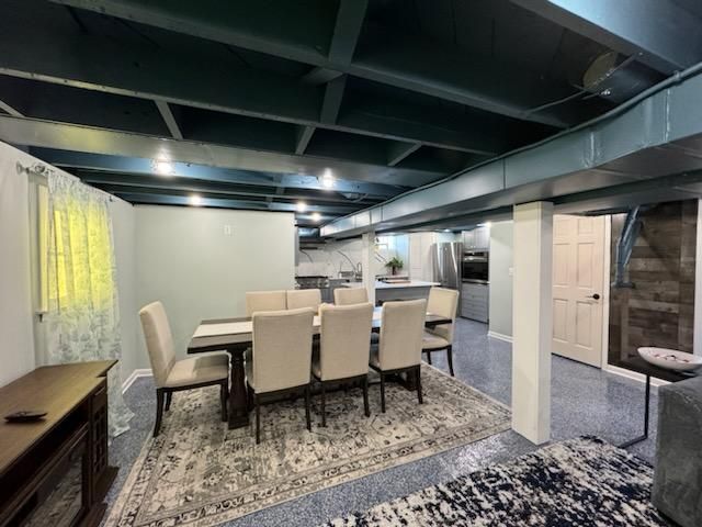 Basement dining area with table and chairs