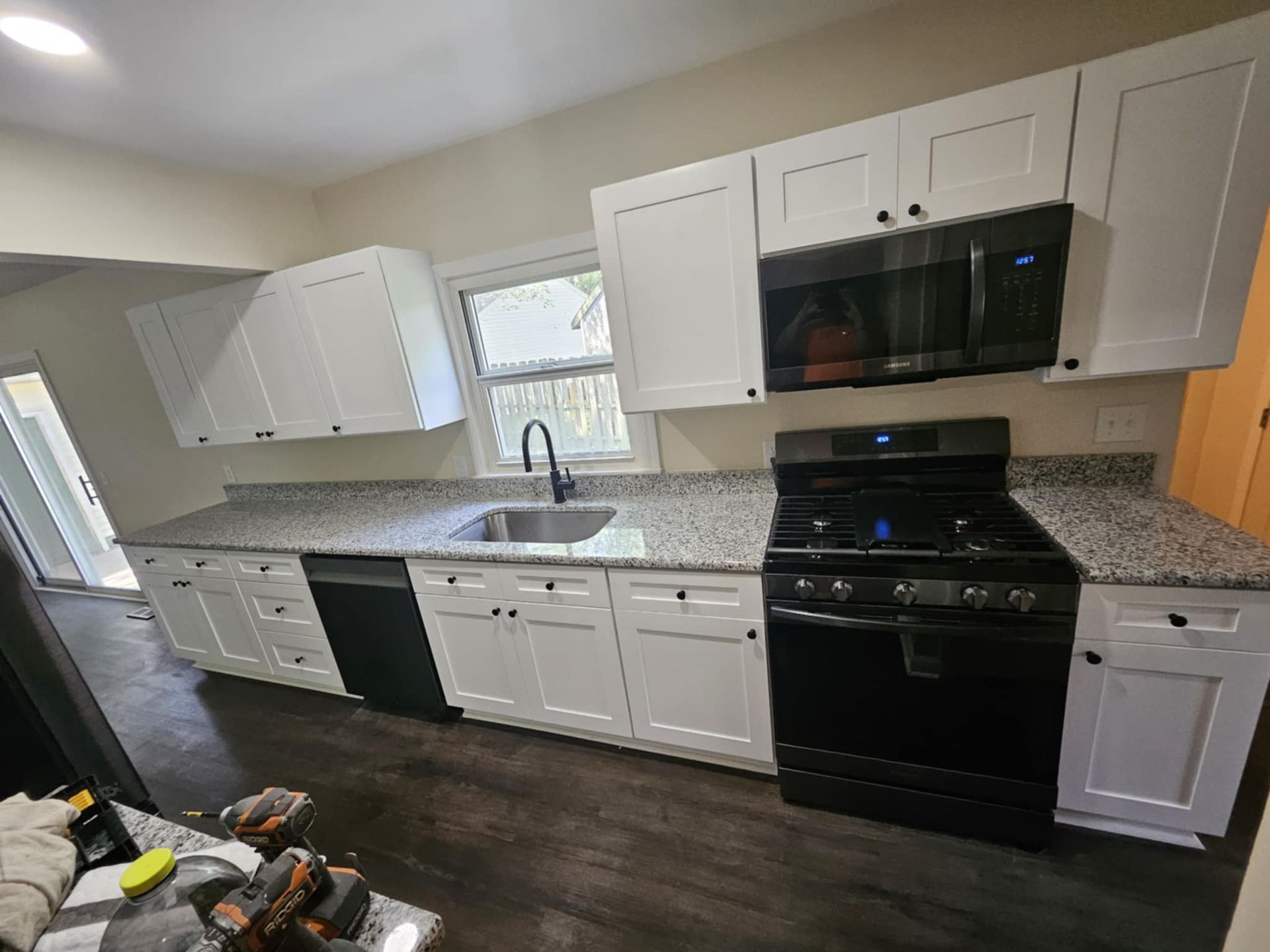 Kitchen with white cabinets and granite countertops